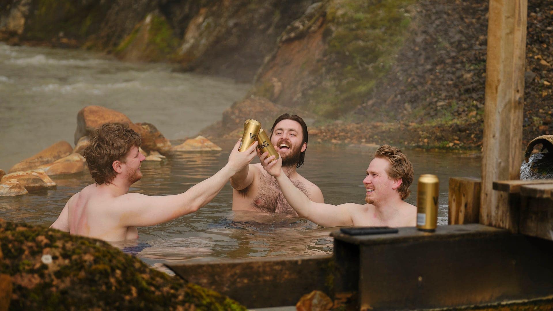 A man standing on a cliff overlooking Hrafntinnusker